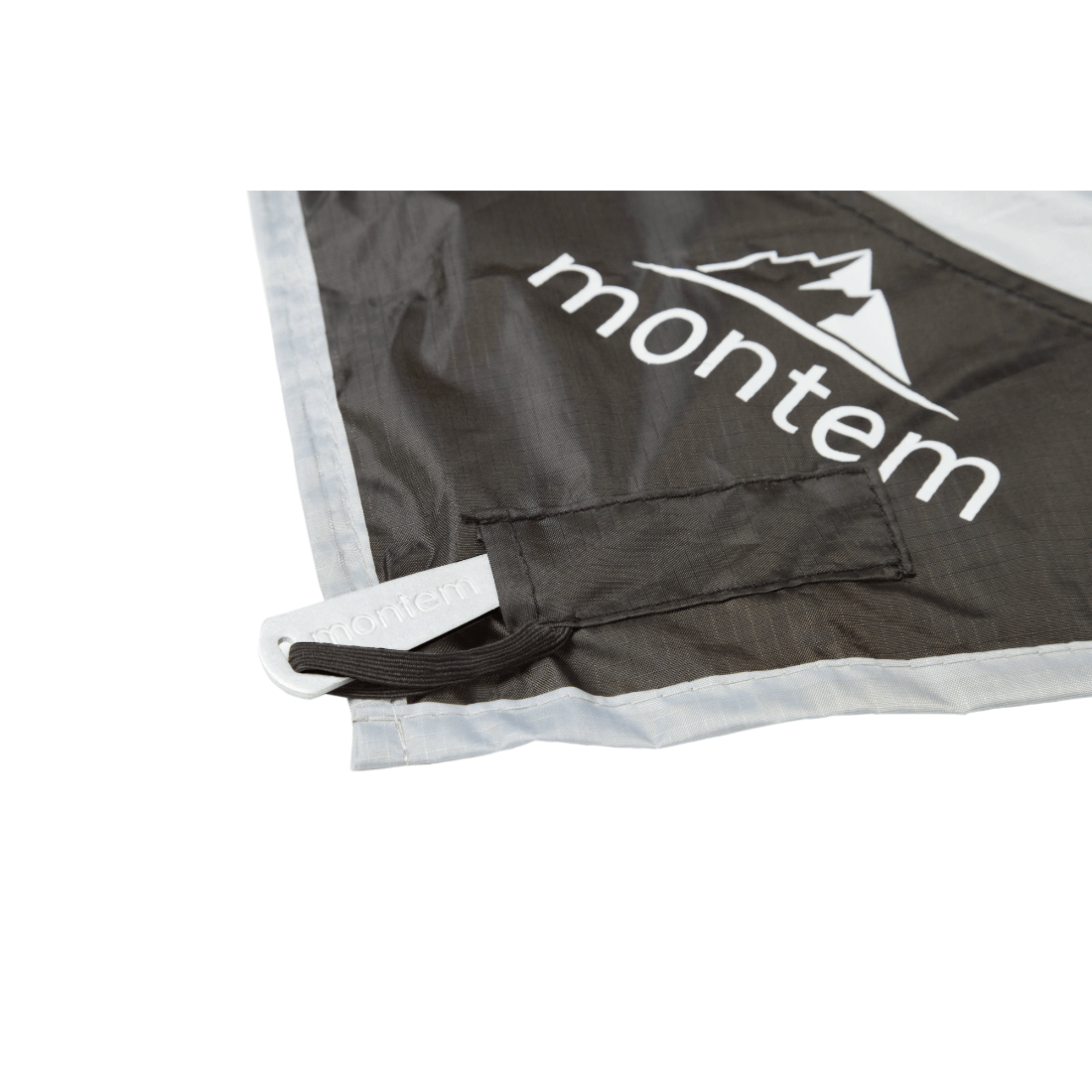 A corner of The Montem Fortem Pocket Blanket outdoor camping.